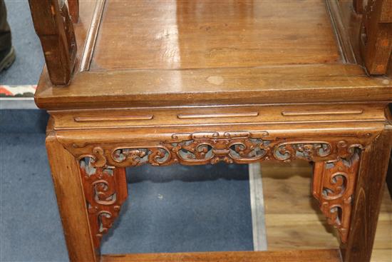 A pair of Chinese carved hardwood elbow chairs